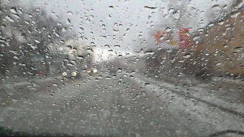 Abnormal weather and climate change, large hail falls on the windshield of the c Stock Footage 126776124