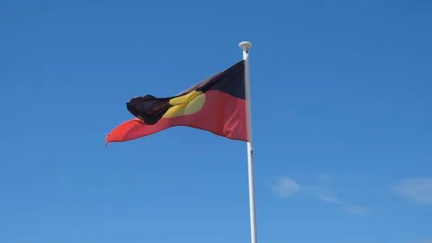 Aboriginal flag of Australia waves in the wind, symbol of Indigenous group Vídeo Stock 291591313