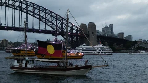 Aboriginal flag on a boat and Sydney Harbour bridge 6K Stock Footage 330445183