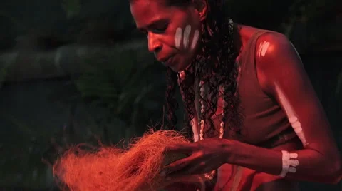 Aboriginal people light fire from by rubbing sticks Stock Footage 63554952