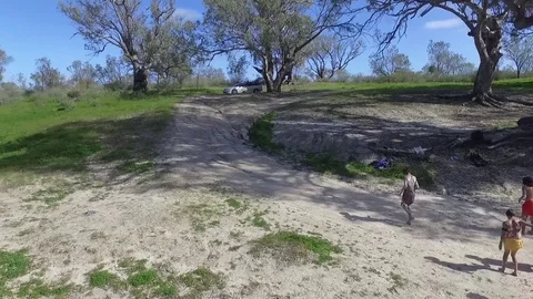Aboriginal young kids dancing on the side of the river in Australia Stock Footage 72225902