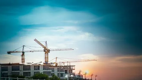 About 3 tower cranes installed at a construction site to build the city and.. Stock Photos