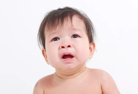 About to cry Asian baby girl Stock Photos