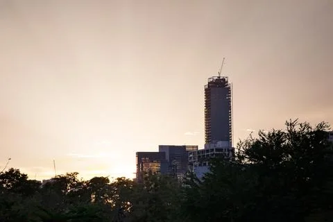 About the tower crane at the construction site event evening looking from bel Stock Photos