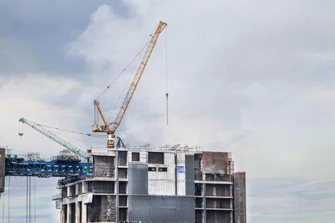About the tower crane at some of the construction sites when sunset that is.. Stock Photos