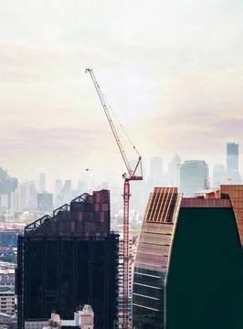 About the tower crane at some of the construction sites when sunset that is.. Stock Photos