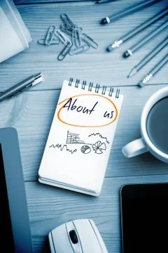 About us against notepad on desk Stock Illustration