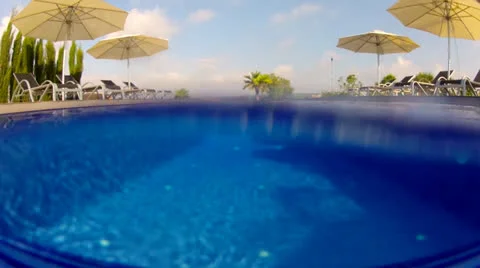 Above and below water view of a swimming pool Stock Footage 25265986