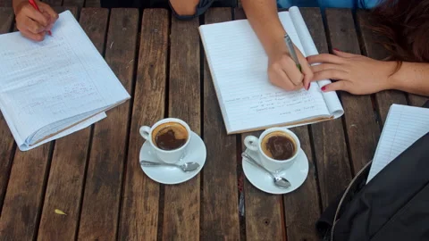 Above angle view of casual entrepreneur woman team/student team, writing down th 스톡 동영상 199634337