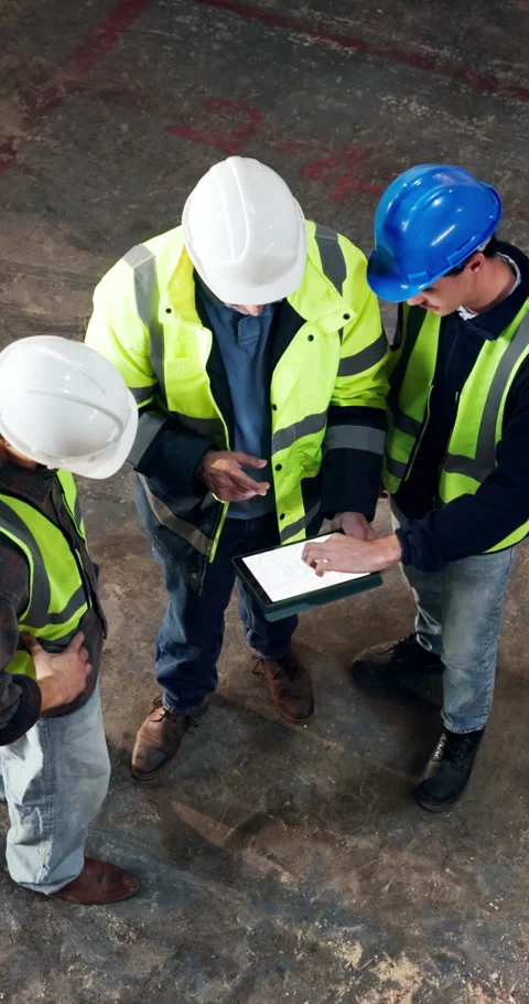 Above, architect and team at construction site with tablet screen, blueprint or Stock Footage 340604460