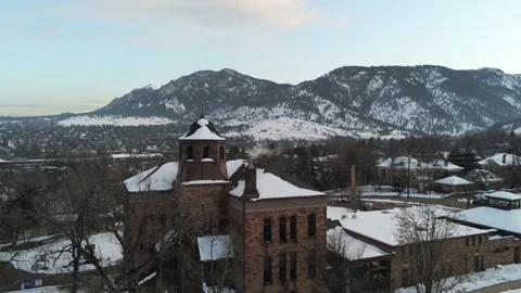 Above building to mountains - Drone camera moves forward Stock Footage 137893888