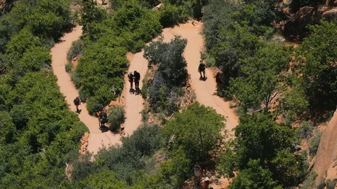 Above a canyon trail zig-zagging up a cliff in Zion National Park. Stock Footage 128777581