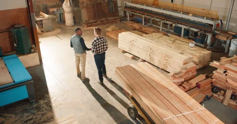 Above, carpentry and men in workshop talking for planning, furniture material Stock Footage 341309761