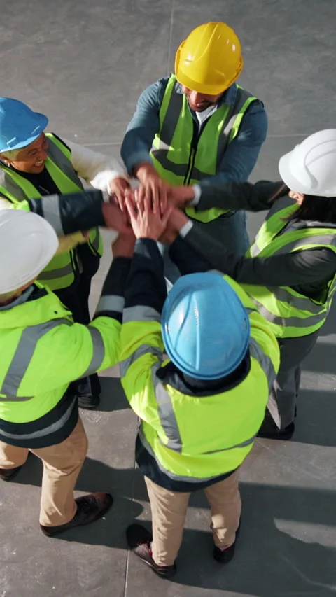 Above, celebration and engineer with hands together in warehouse for Stock Footage 342324330