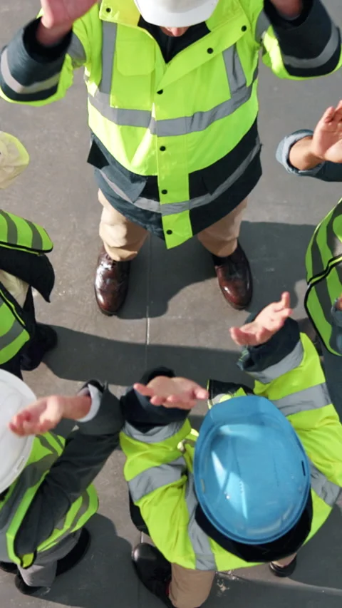 Above, clapping and construction team with stack of hands on site for Stock Footage 342326079