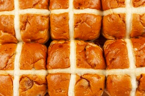 Above close up of a batch of hot cross buns Stock Photos