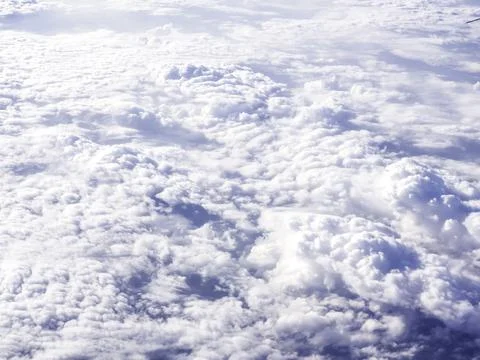 Above the cloud, sky view from airplane window. Stock Photos