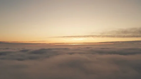 Above the clouds airplane view at dawn, spectacular background aerial 動画素材 118589245