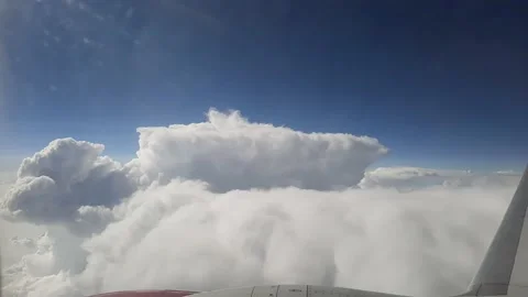 Above clouds from airplane window, above the clouds, aerial photography. Stock Footage 166714409