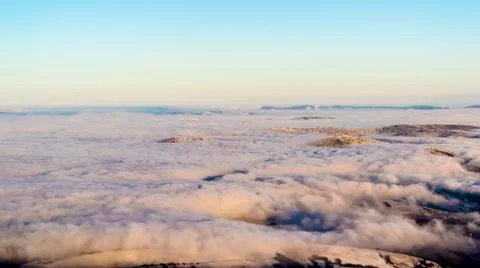 Above the clouds in dusk Stock Photos