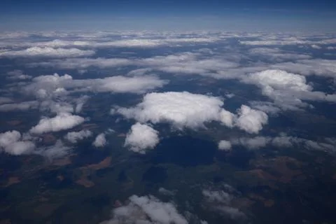Above the clouds, from a height of flight Фото