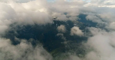 Above clouds looking at valley 2 Stock Footage 91462407