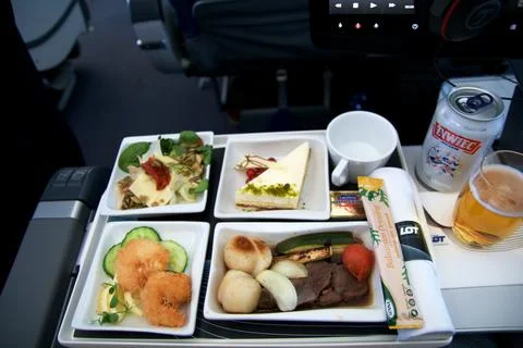 Above the clouds, May 10 2018: Premium economy inflight meal with courses and Stock Photos