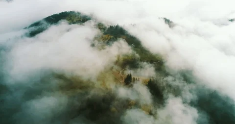 Above the clouds in the mountains Stock Footage 128699806