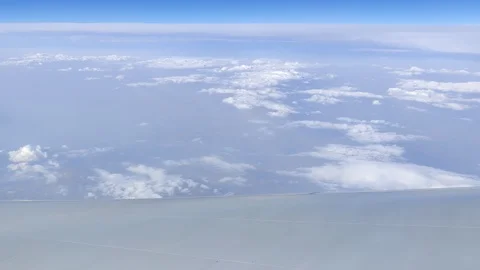 Above the clouds - Plane flying through cloudy sky window perspective, 4K Stock Footage 122662682