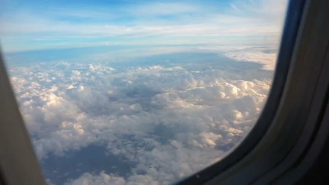 Above clouds, sky as seen in window of an aircraft Video stock 112130342