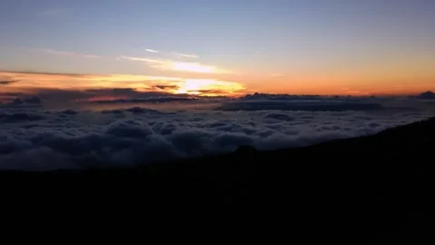 Above the clouds sunset in a mountainous area blanket of clouds Stock Footage 197406188