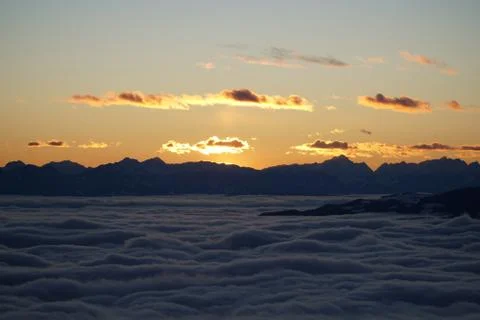 Above the clouds at sunset Stock Photos
