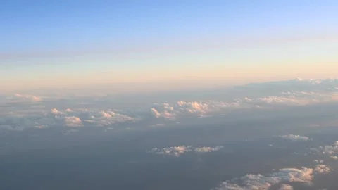 Above the clouds, sunset time, aerial view from the plane window Stock Footage 161241678