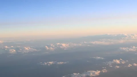 Above the clouds, sunset time, aerial view from the plane window Stock Footage 162104370