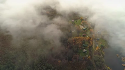 Above clouds thick fog authentic small village Karelia Russia Lake Ladoga coast Stock Footage 156385207