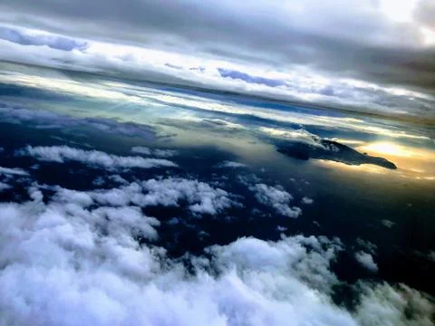Above the clouds. View from airplane. Stock Photos