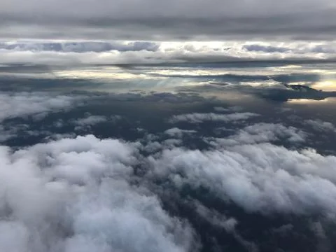 Above the clouds. View from airplane. Stock Photos