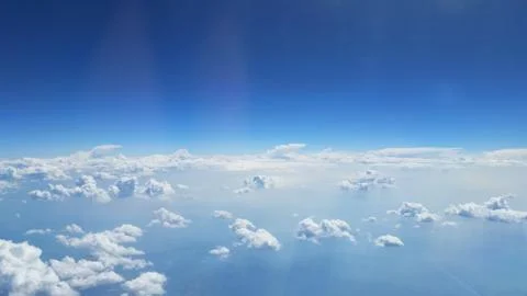 Above the clouds view from an airplane Stock Photos