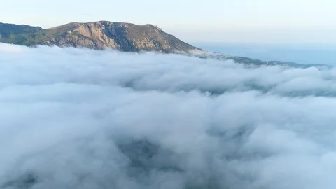 Above the clouds with a view of the mountain. Air View. Crimea. Stock Footage 126267502