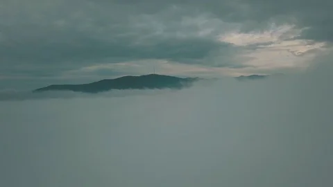 Above the clouds. View of the mountain with a TV tower Stock Footage 92860660
