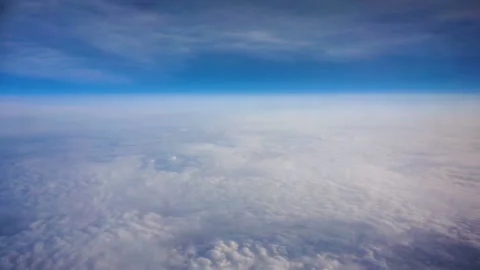 Above clouds, view from pilot cabine airplane. Blue sky, white clouds with magic Video stock 111757150