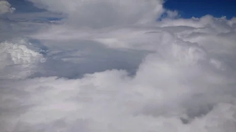 Above the clouds, View through an airplane window Stock Footage 80150641