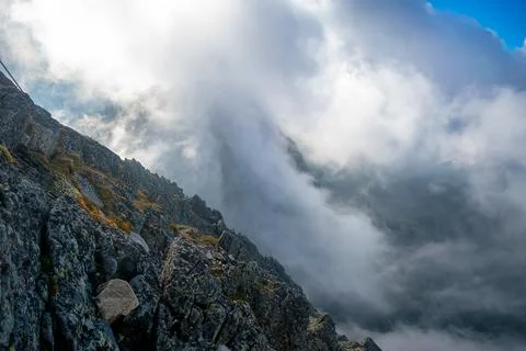 Above the clouds. View from the top of the mountain. Stock Photos