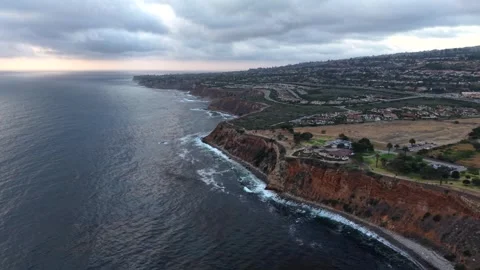 Above the Coastline at Sunset by a Lighthouse Video stock 340578891