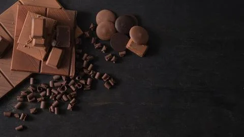 From above composition of assortment of fine chocolates on dark background .. Stock Photos