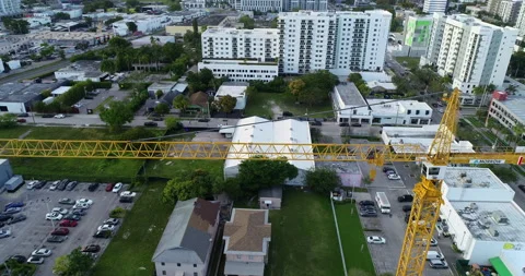 Above a construction crane in Miami Stock Footage 172507119