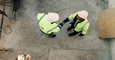 Above, construction site and men with handshake for building collaboration, new Stock Footage 336225015