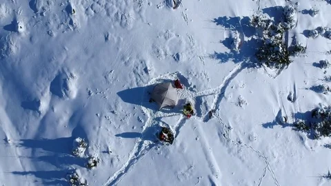Above drone-footage of two persons camping in the snow (color corrected) Stock Footage 84036314