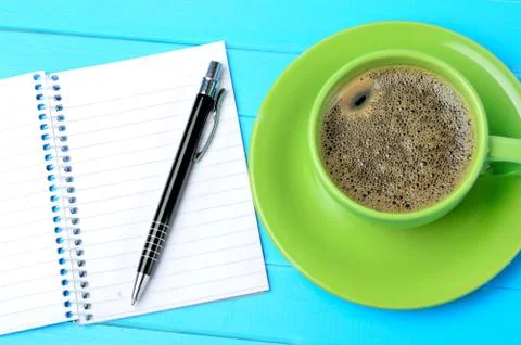 Above empty notebook with cup of coffee Stock Photos