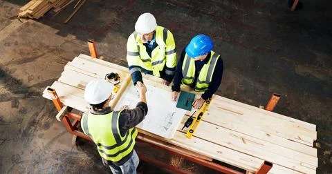 Above, engineer and handshake at construction site with blueprint, developm.. Stock Photos